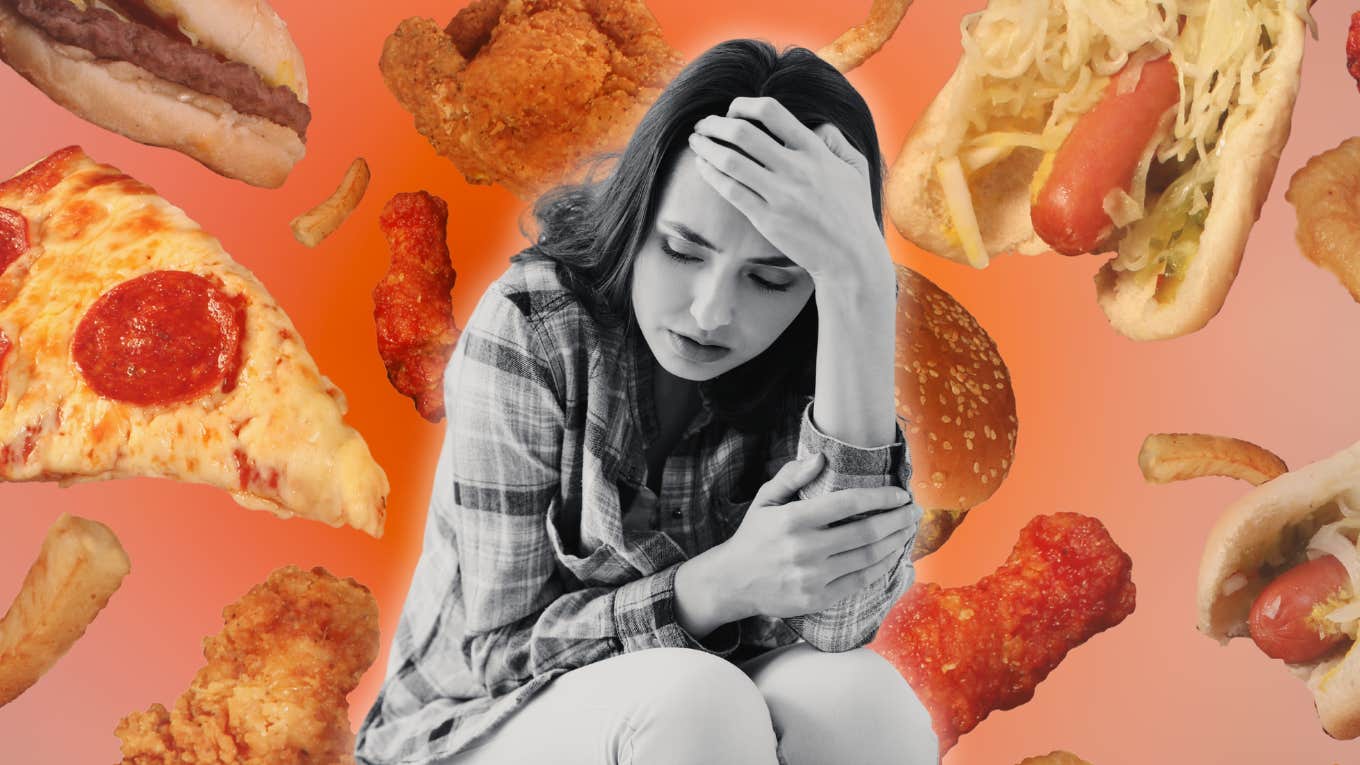 7 Small Dietary Shifts That Will Dramatically Reduce Your Anxiety Woman with anxiety surrounded by bad foods