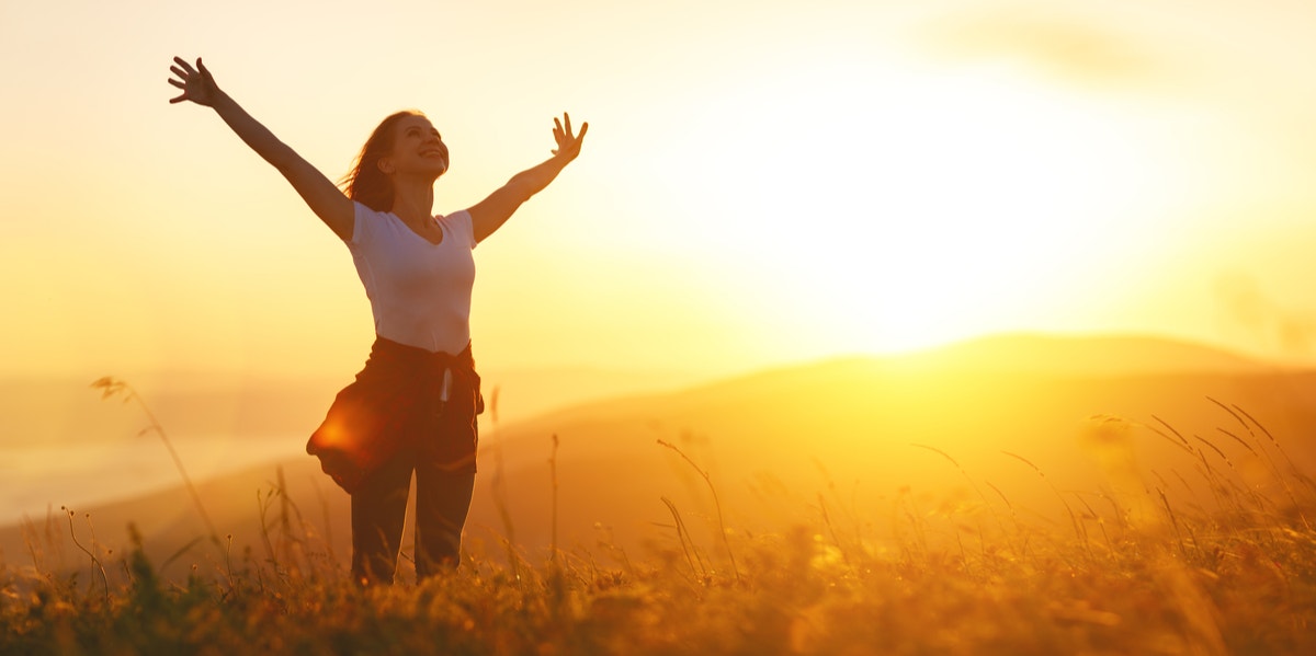 confident happy woman in a field