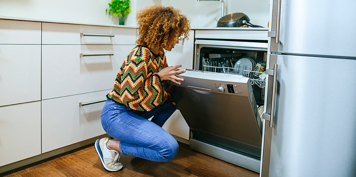 How To Cook An Entire Meal In Your Dishwasher woman at dishwasher
