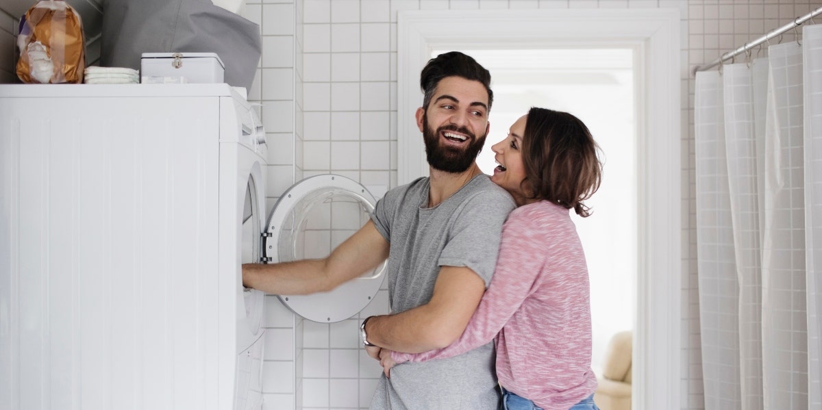 dividing domestic labor couple doing the laundry