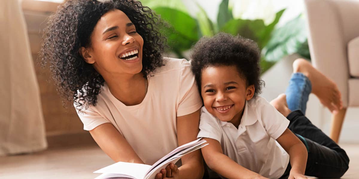 Divorce good for kids Mother and child reading on the floor
