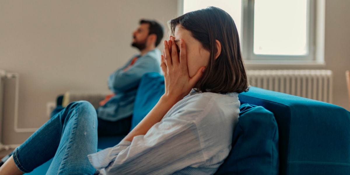 woman upset with man in room