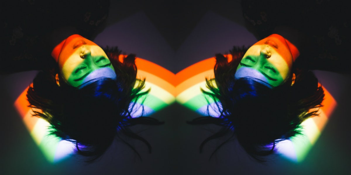 24 Divorce Recovery Myths & 5 Ways To Help You Cope And Heal woman laying on floor with rainbow reflection on her face