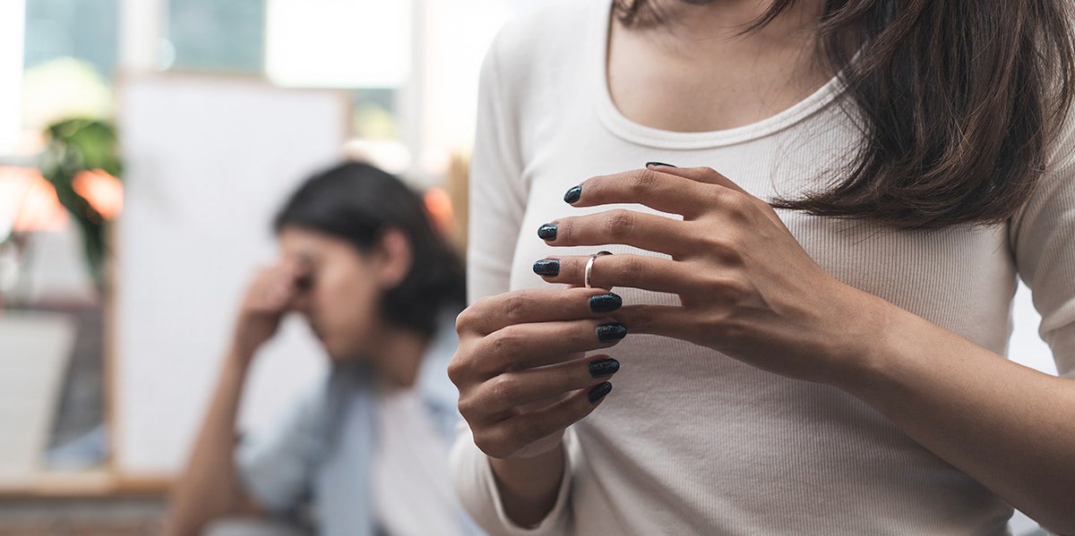 woman touching her wedding band