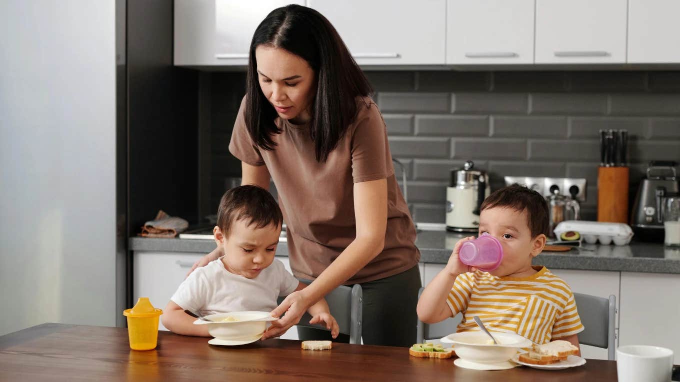 mom feeding two kids