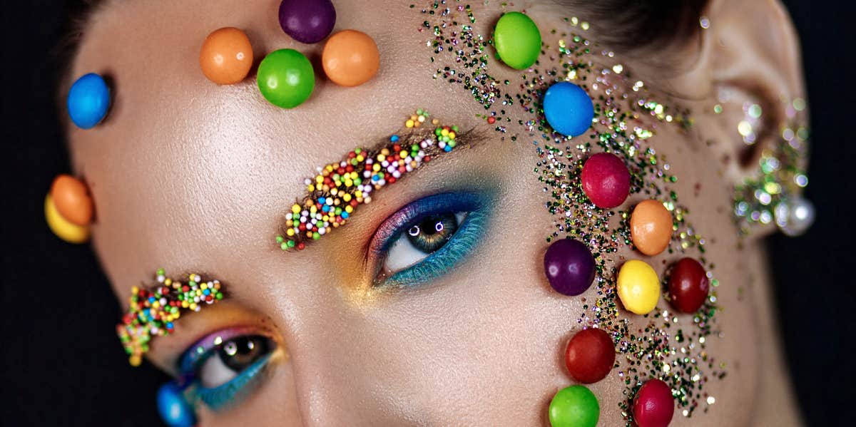 I Conducted A Skittles Taste Test To Find Out If Every Color Is Exactly The Same candy on a woman's face