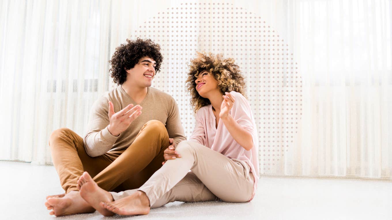 Couple sitting on the floor discussing their future