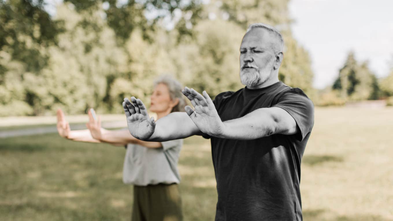 Man starting his day with stretching and meditation