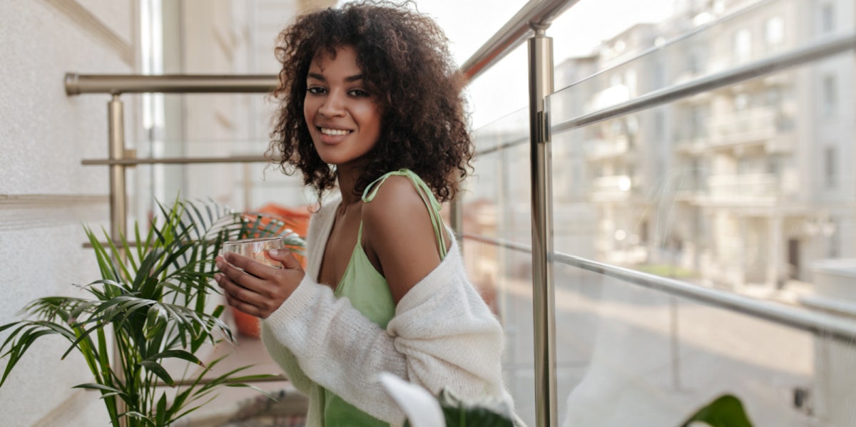 I Do What I Want (And You Should Too) woman on balcony smiling