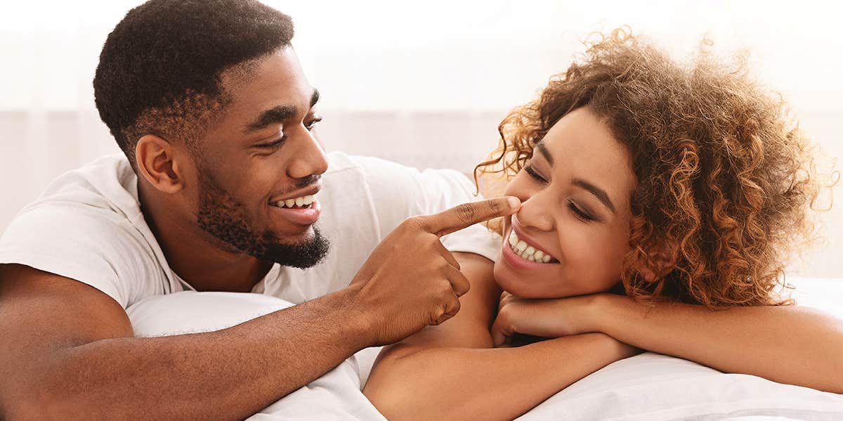 couple playing in bed