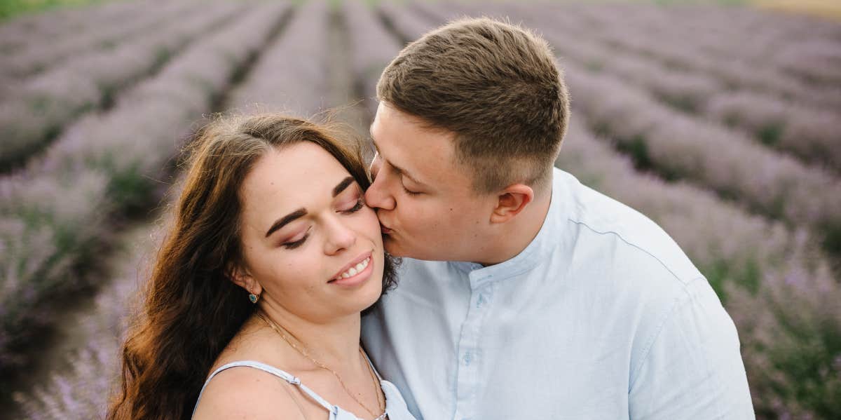 couple kissing in lavender field