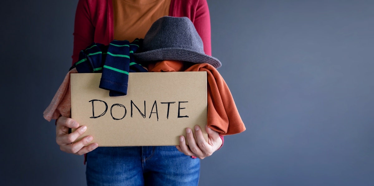 clothes donation box woman donating clothes