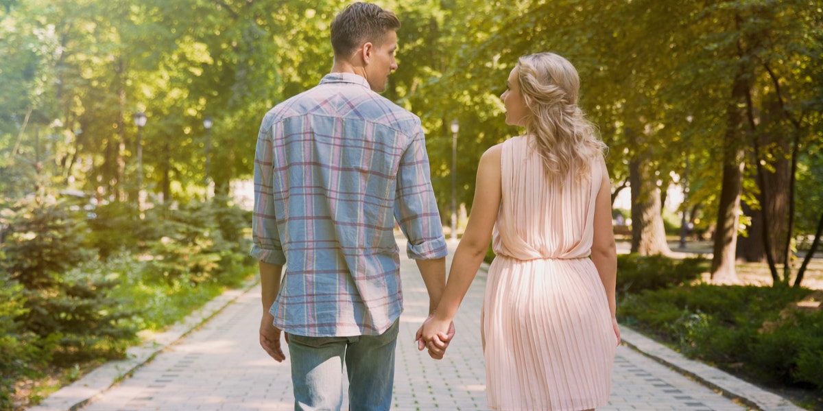 man and woman holding hands