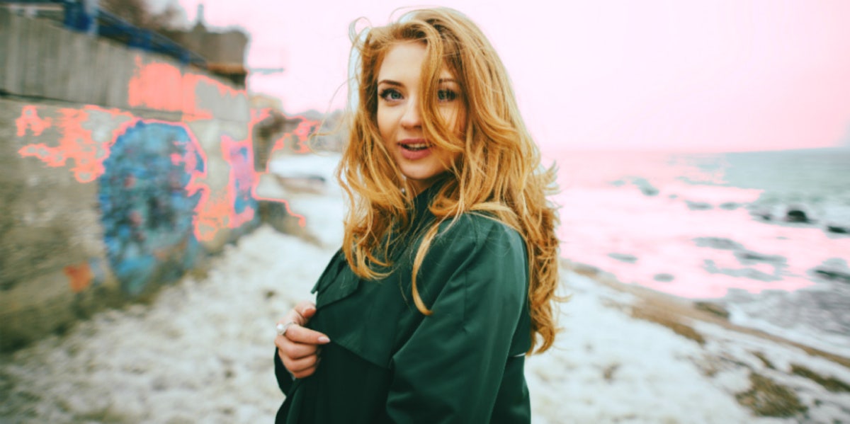 woman smiling by the beach