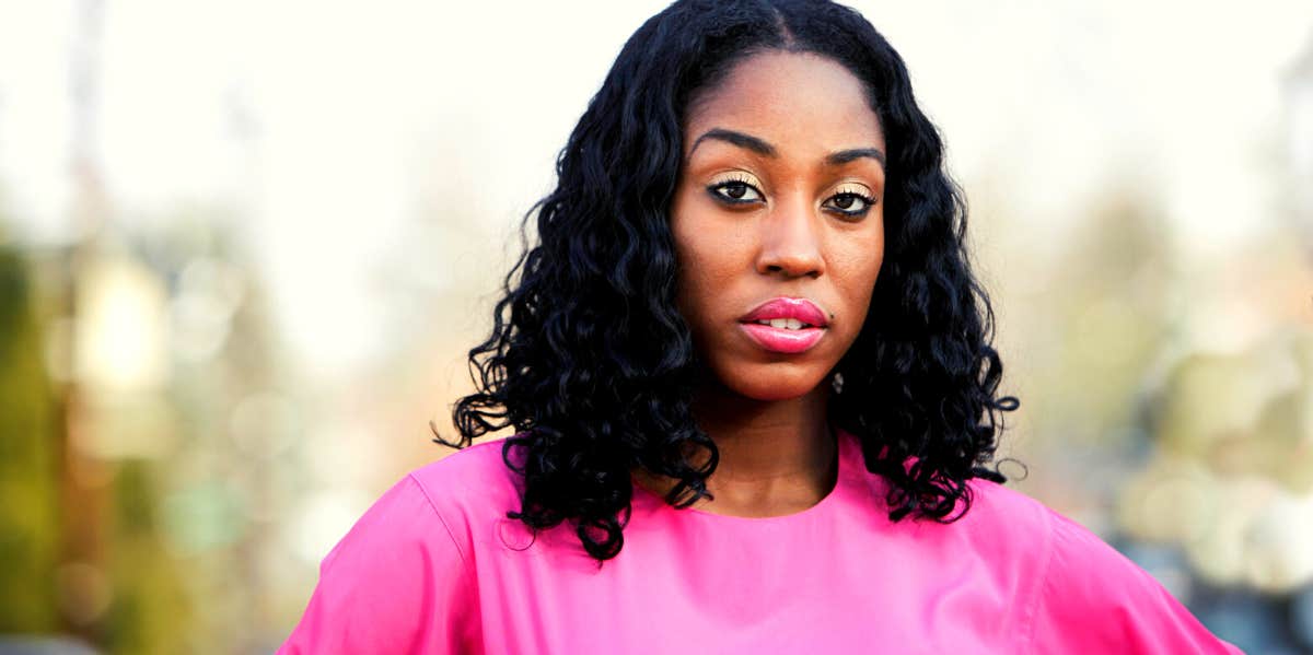 woman in pink shirt