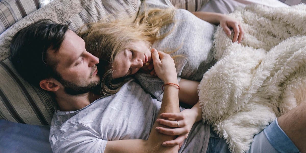 couple cuddling in bed