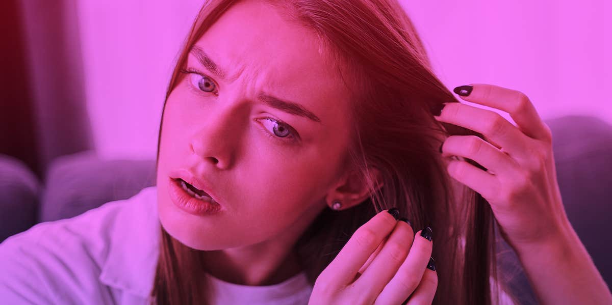 woman touching hair