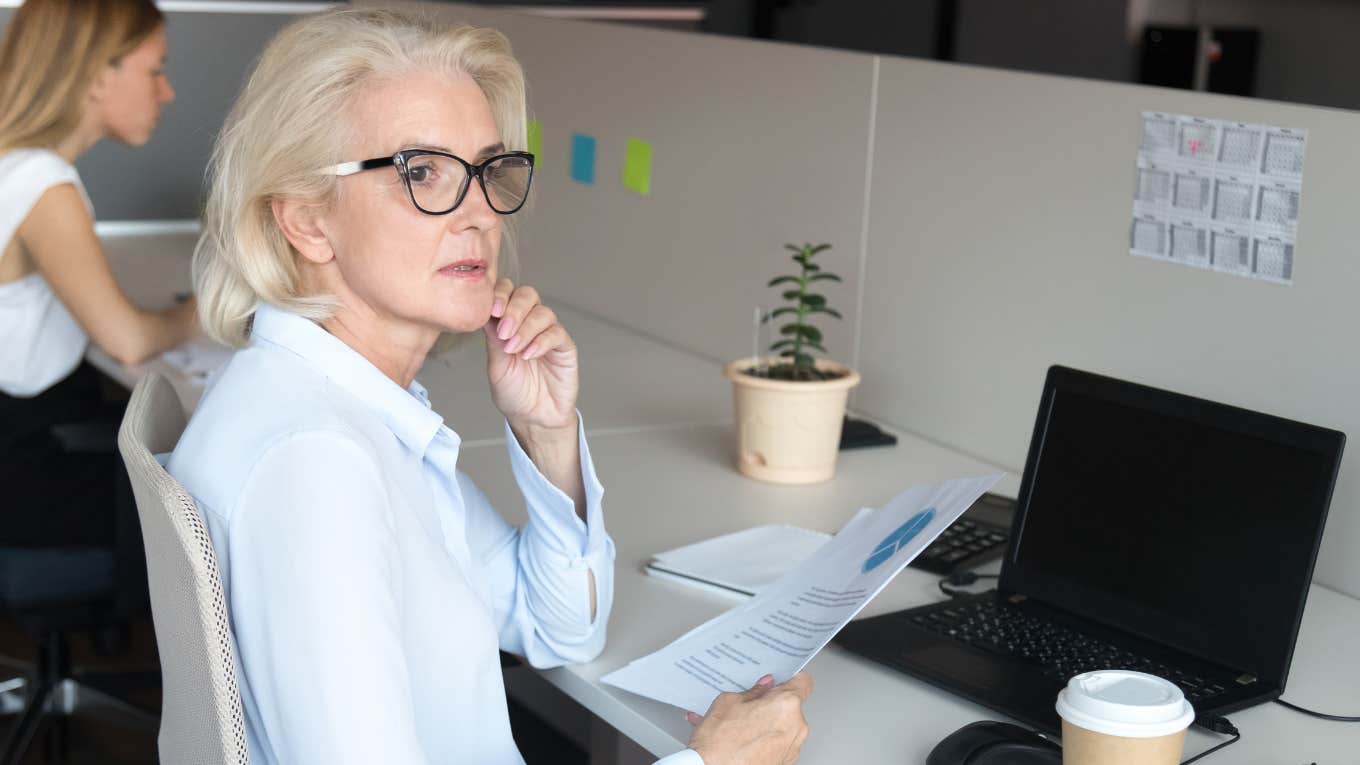 older woman pondering her dreams and goals 