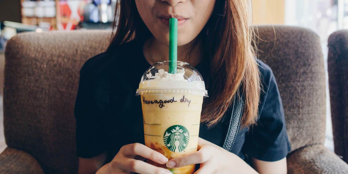 woman drinking starbucks coffee