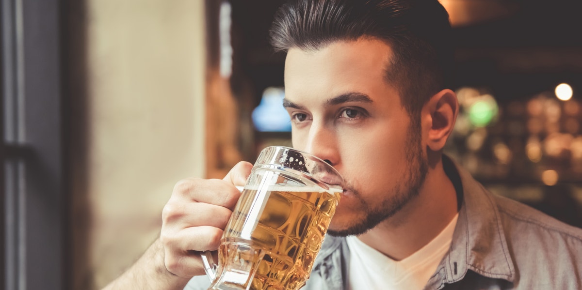 man drinking beer