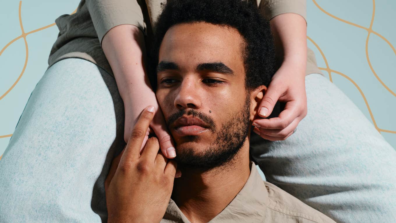 Man possessively holding woman close