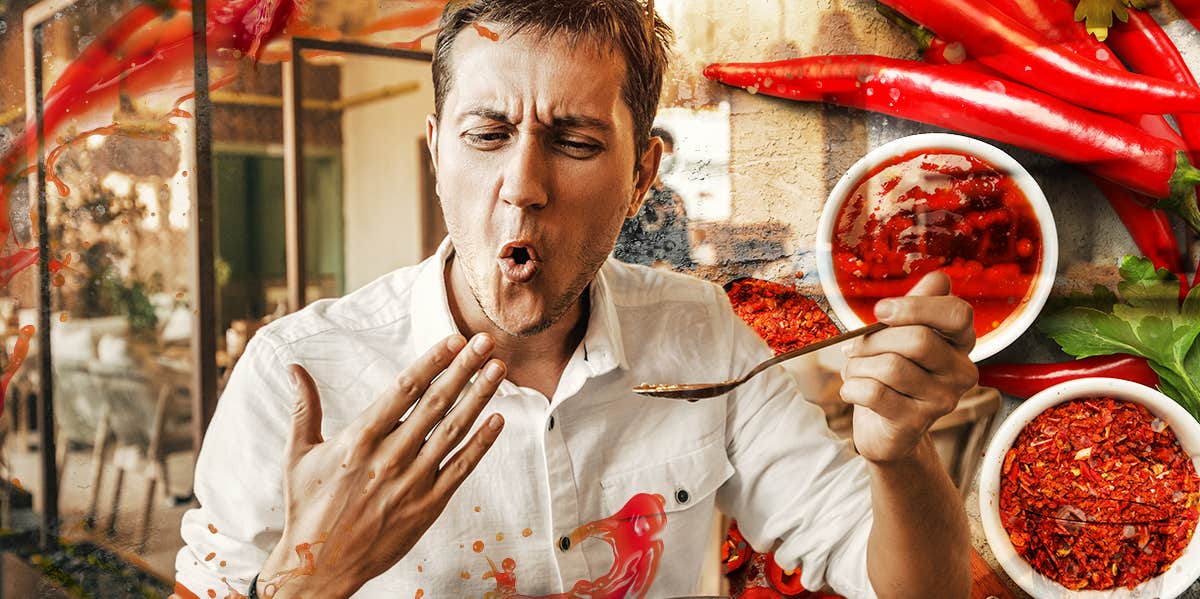 Man trying to cool off mouth after eating spicy food