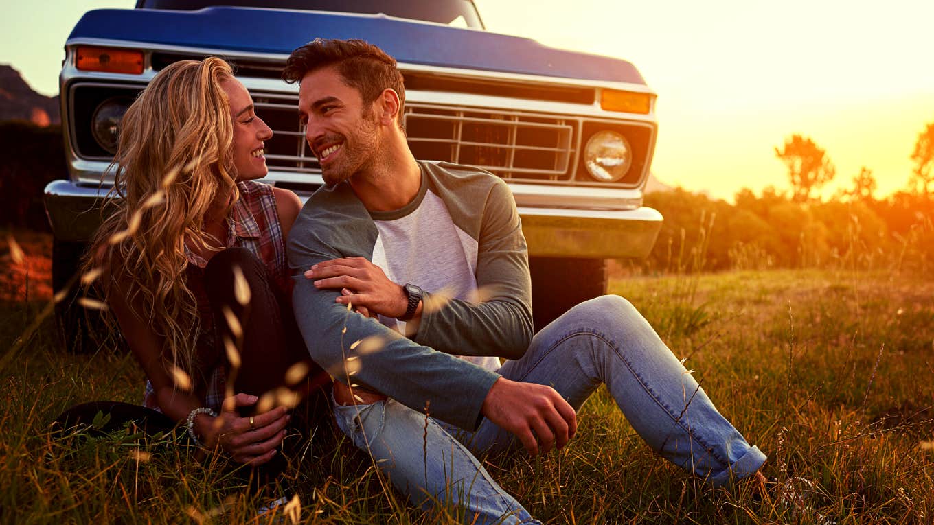 Effective Qualities That Keep Relationships Together Forever happy couple sitting in front of their car