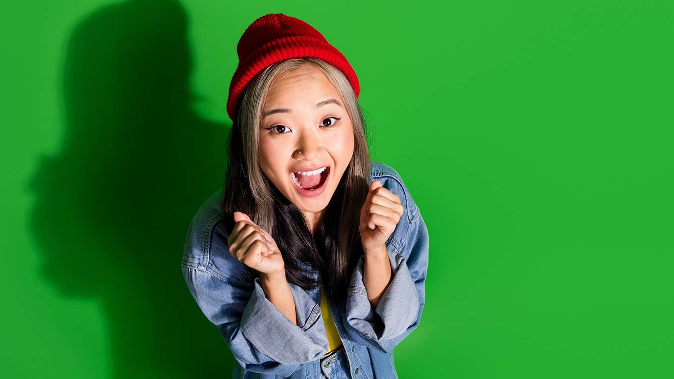 excited happy lucky woman wearing beanie