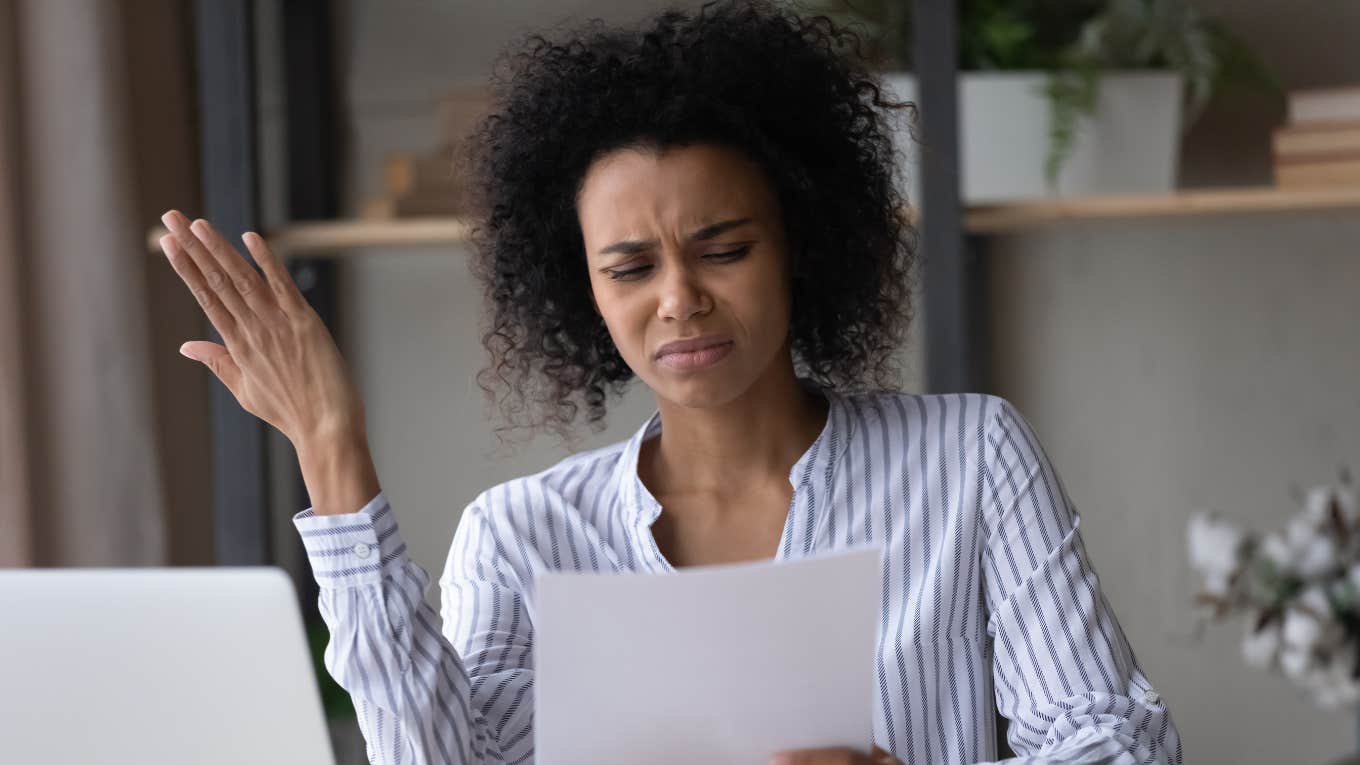 confused woman reading coded language used in toxic workplaces