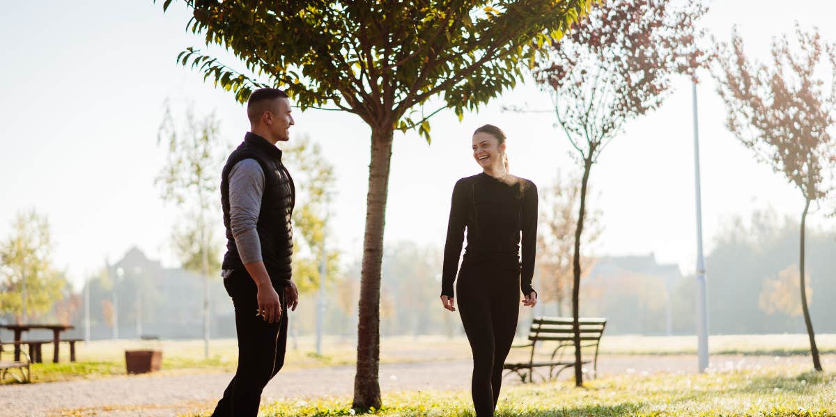 man talking to a woman in the park