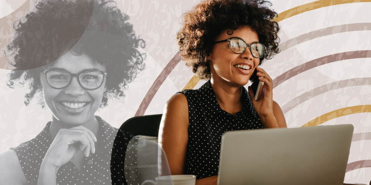 Woman happily working on her laptop