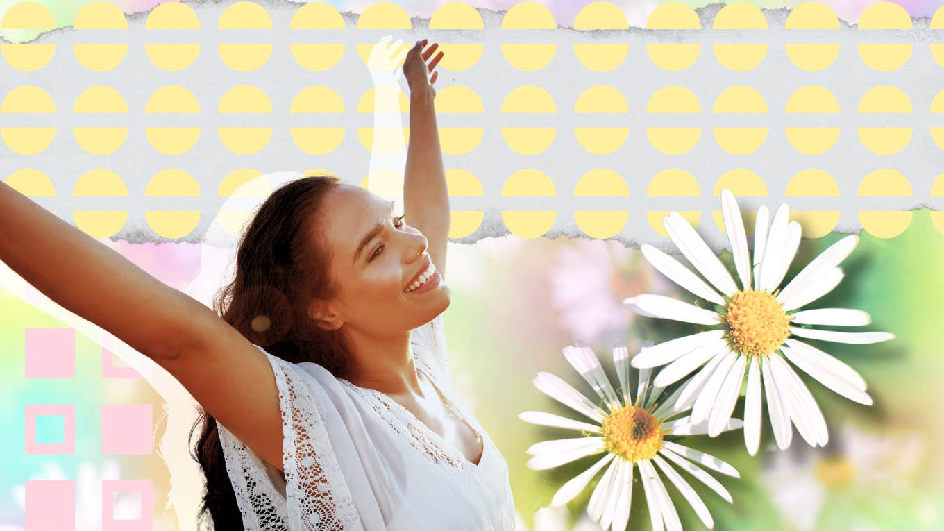 Woman feeling inspired, arms up smiling 