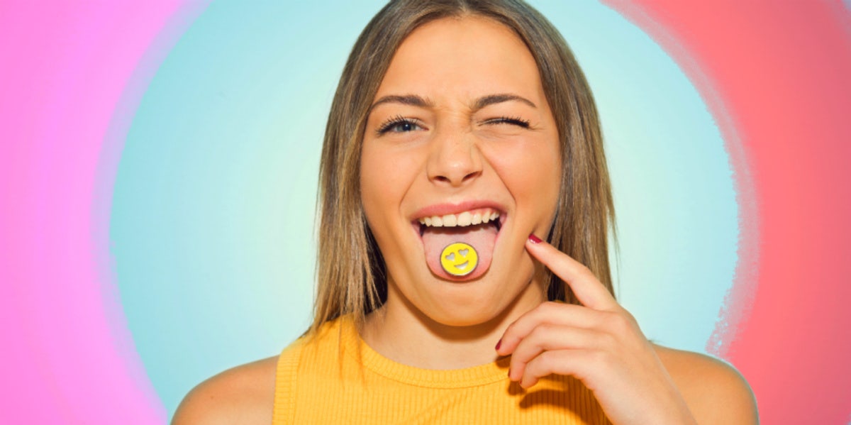 woman with smiley face on her tongue