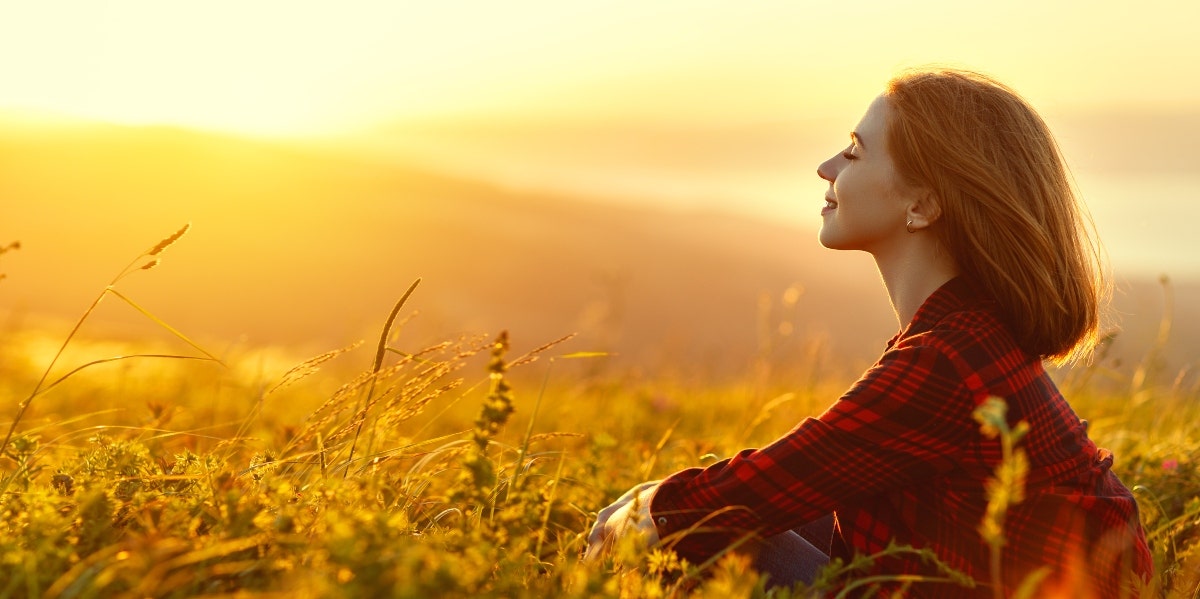 woman relaxing in grass