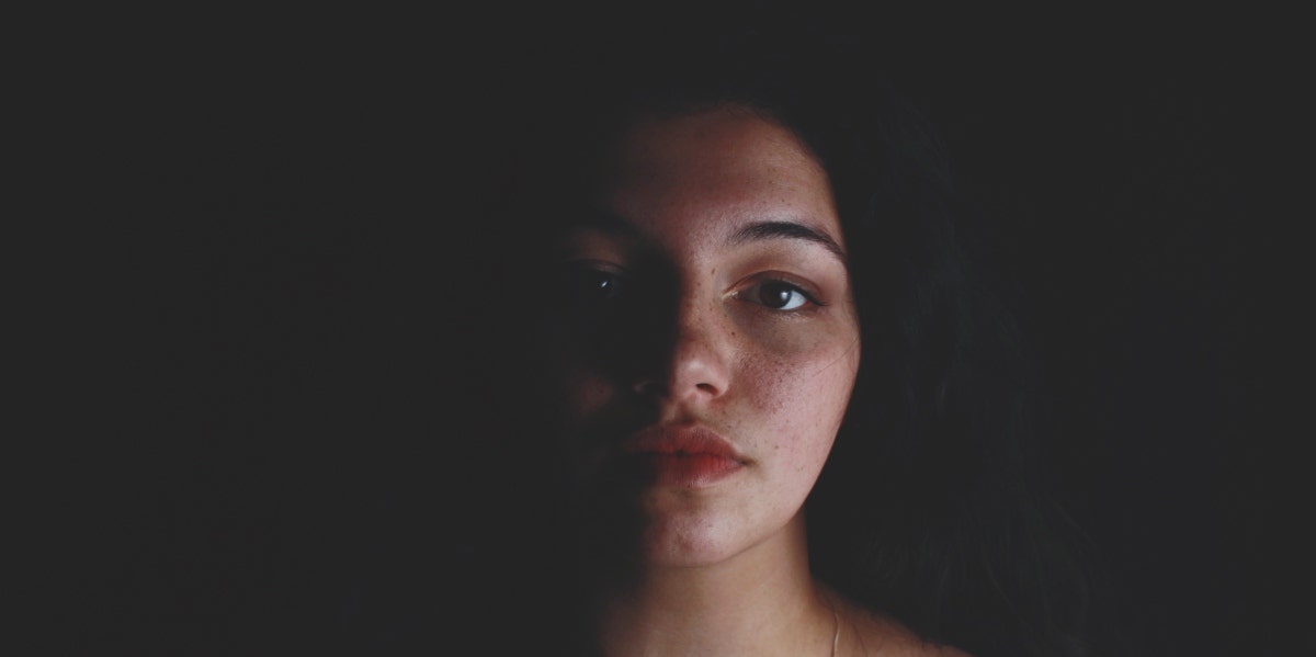 emotional turmoil sad woman in the dark