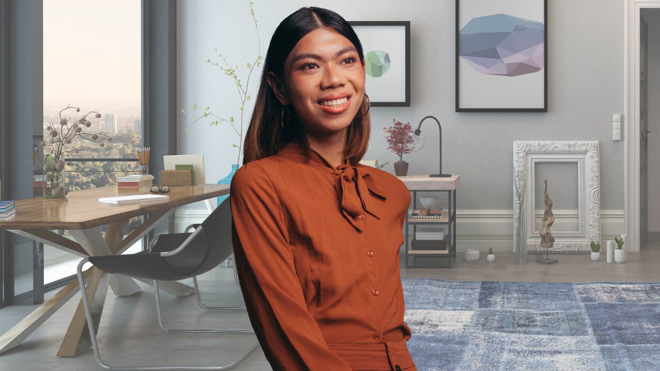 Woman smiling in a trendy office space. 