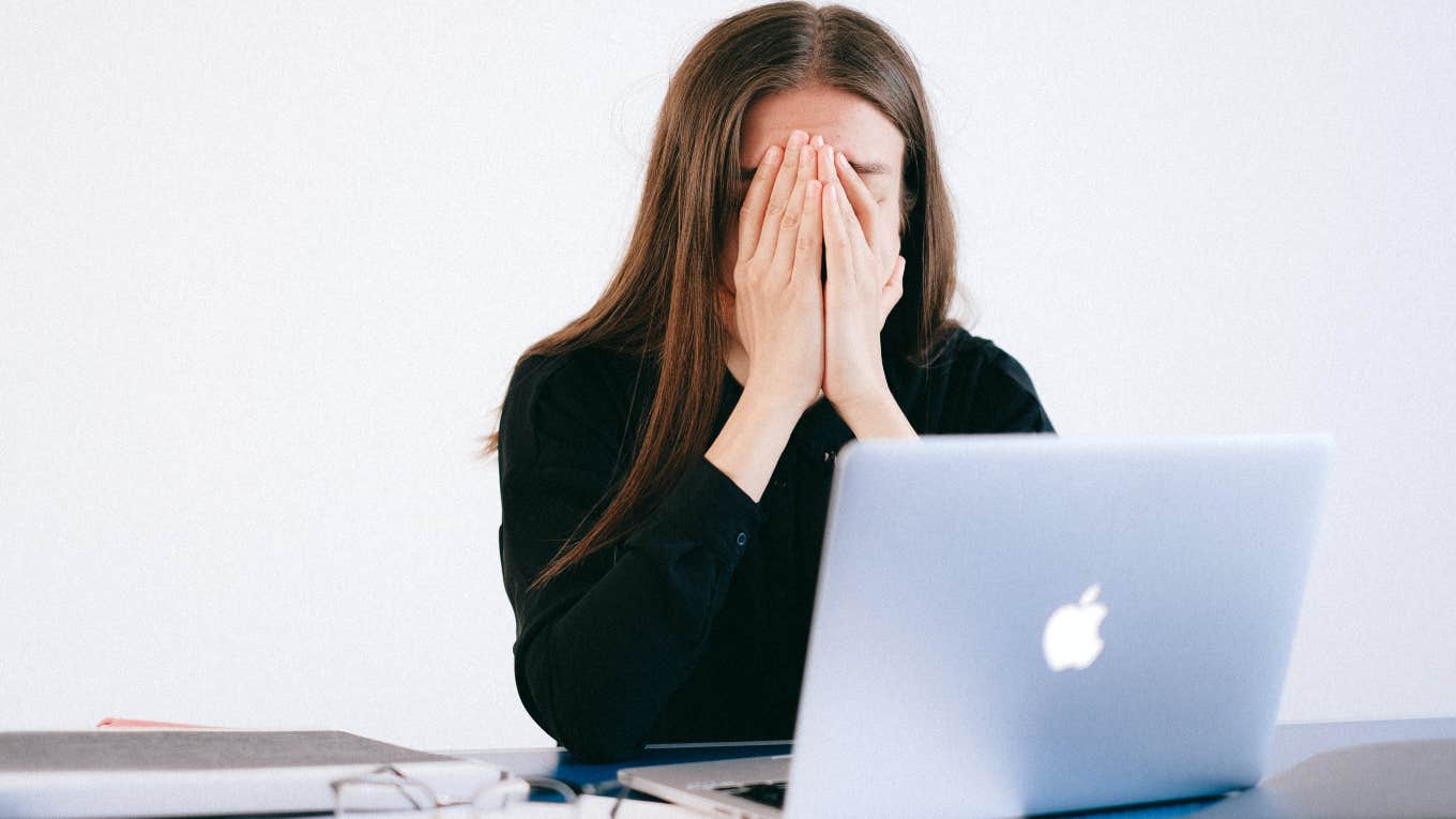 Employee Spent 15 Years At A Company To Be Fired In 5 Minutes woman sitting in front of computer frustrated