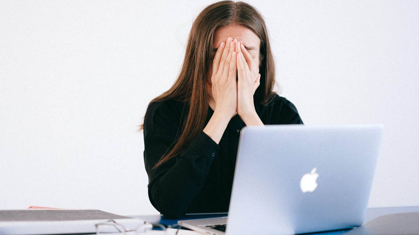 woman sitting in front of computer frustrated