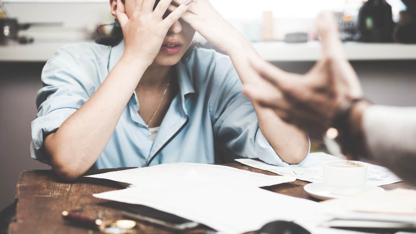 stressed out employee getting yelled at by boss