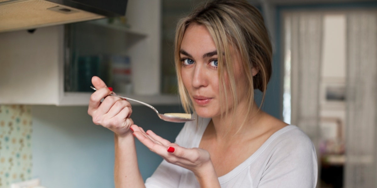 woman tasting food