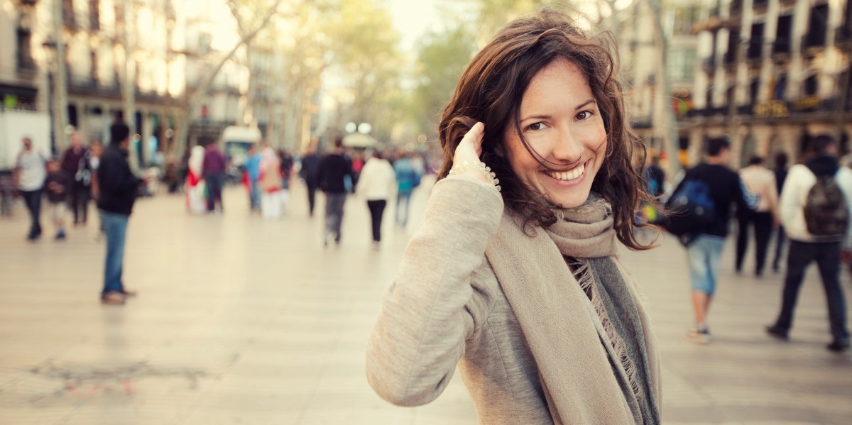 happy and energetic woman in winter cityscape