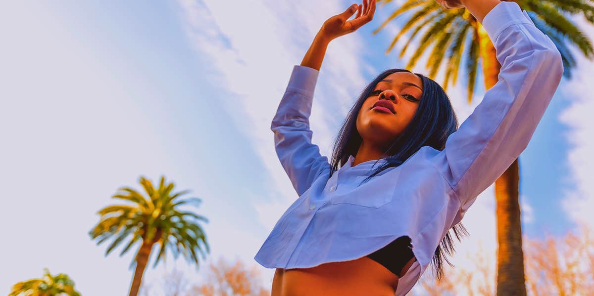 The Dark Side Of The ENFP Personality Type outgoing woman stretching up