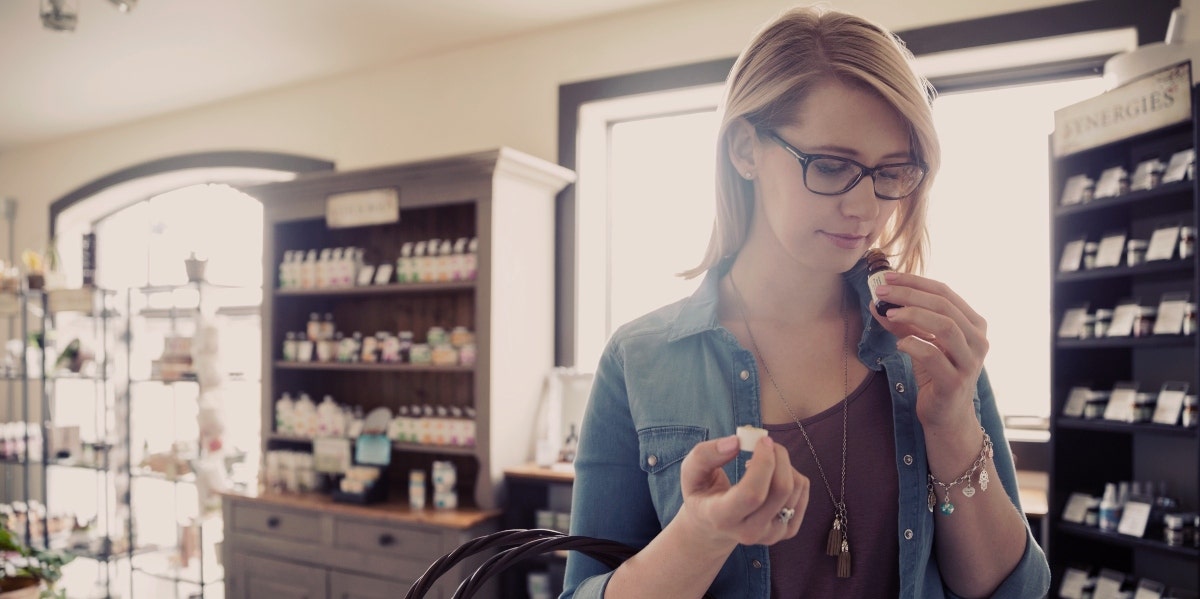 woman smelling essential oils