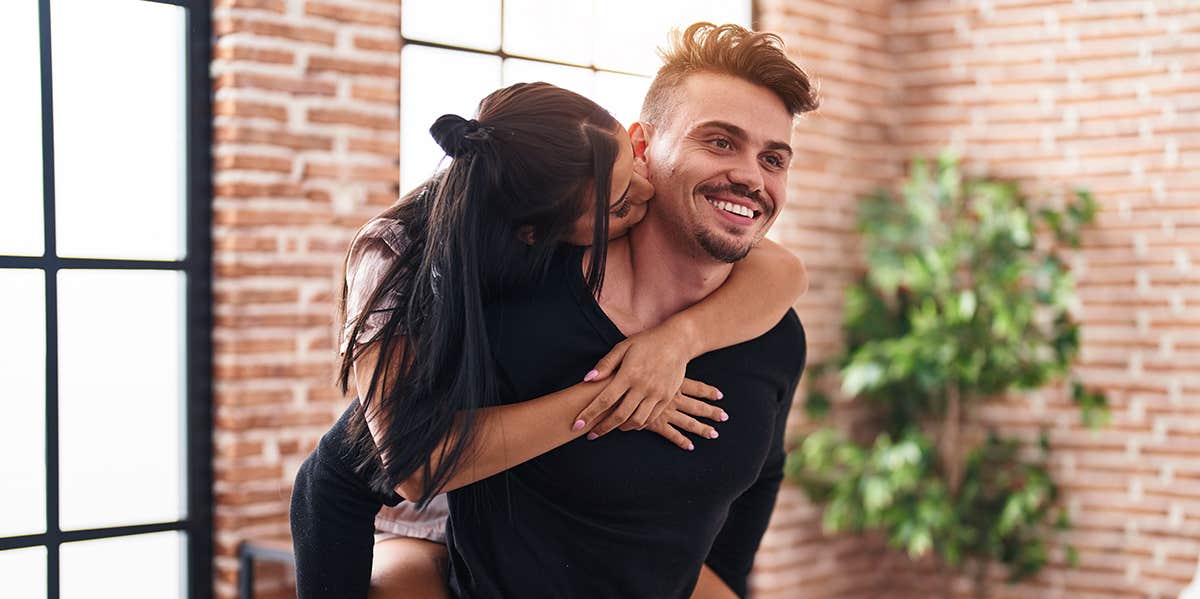 7 Essential Truths Men Need To Understand About Women In Order To Be A Better Husband guy carrying girl on his back as she kisses him