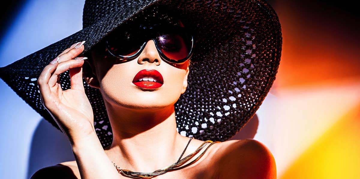 The Dark Side Of The ESTJ Personality Type woman in a big hat