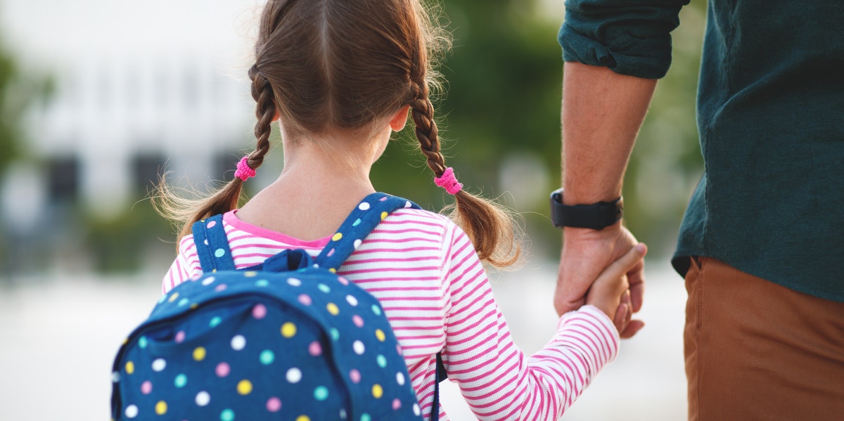 8 Things Every Parent Should Do On The First Day Of School, According To A Teacher woman carrying backpack