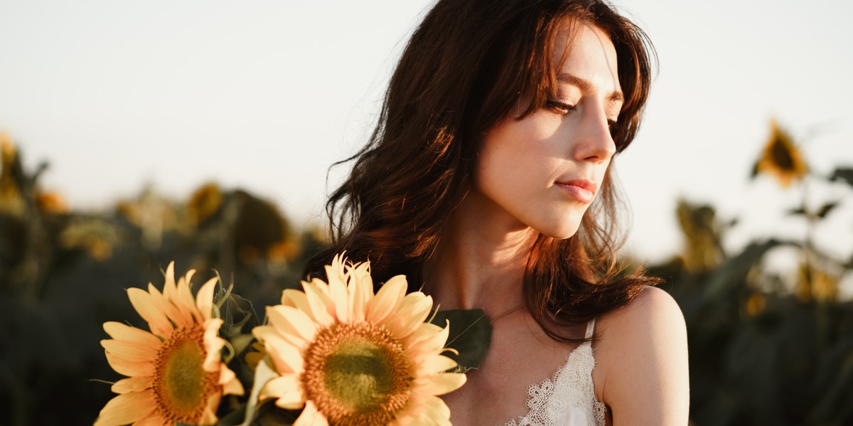 woman in sunflower field