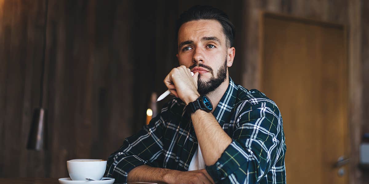 man sitting at cafe