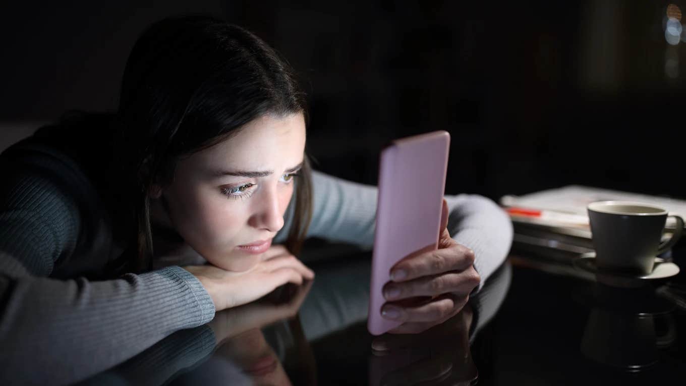 depressed teen girl with smartphone