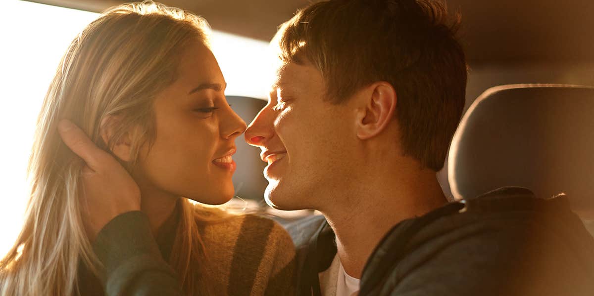 Couple about to kiss in a vehicle